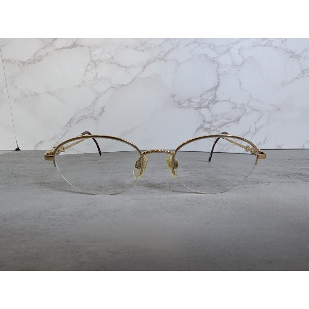 Yves Saint Laurent Gold Rimless Oval Glasses